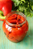 grilled red bell pepper in a glass jar