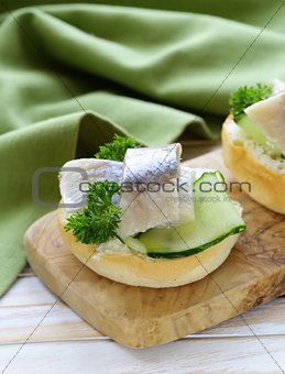 snack sandwiches with cucumber and herring