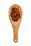 wooden spoon with seasonings on a white background