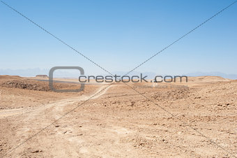 Travel on an empty desert landscape