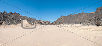 Dry river valley in desert mountains