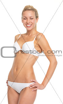 Portrait of happy young woman in lingerie
