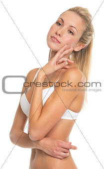 Portrait of relaxed young woman in lingerie