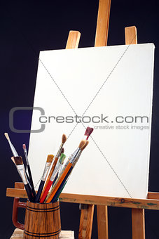 canvas, brushes and easel