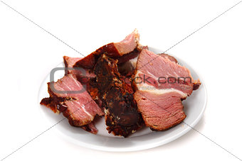 smoked meat on the white plate