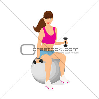 Beautiful woman exercising with two dumbbell weights sitting on the fitness ball