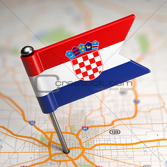 Croatia Small Flag on a Map Background.