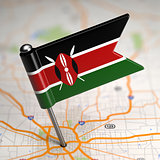 Kenya Small Flag on a Map Background.