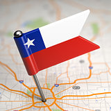 Chile Small Flag on a Map Background.