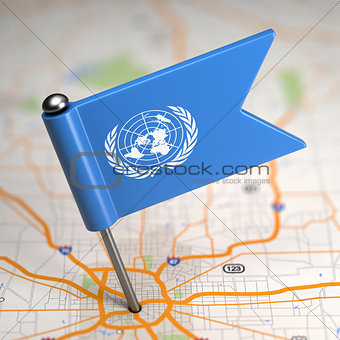 United Nations Small Flag on a Map Background.