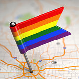 Gay Small Flag on a Map Background.