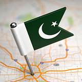 Pakistan - Small Flag on a Map Background.