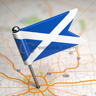 Scotland Small Flag on a Map Background.