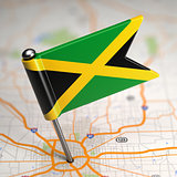 Jamaica Small Flag on a Map Background.