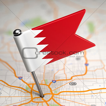 Bahrain Small Flag on a Map Background.