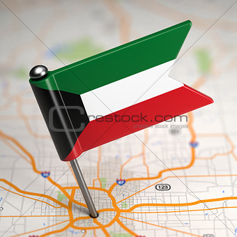 Kuwait Small Flag on a Map Background.