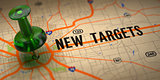 New Targets - Green Pushpin on a Map Background.