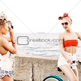 two beautiful girls at sea pier