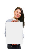 smiling young woman showing blank signboard on white background
