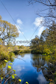 View of the river with the sky and the reflection of clouds