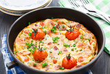Omelet with ham and cherry tomatoes