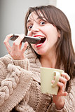 girl eating a mobile phone with her tea