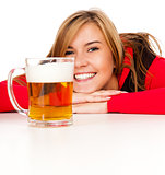 pretty girl in red drinking beer from the mug