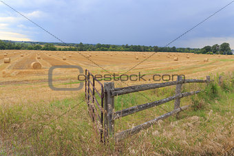 Farmers field with a fence
