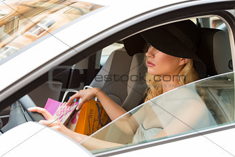 pretty girl with hat driving