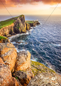 Vertical view of Neist Point lighthouse with rocks foreground, S