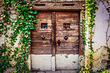 Old wooden textured door and weathered wall