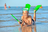  boy with  swimming goggles, snorkel swimming and flippers 