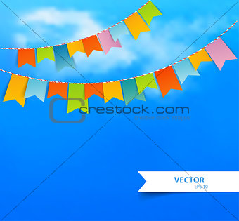 Blue sky with colorful flags