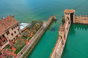 Fragment of surrounding wall of medieval Scaliger castle situated on Lake Garda in Italy (view from above).