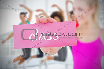 Fit blonde holding card saying class