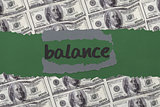 Balance against digitally generated sheet of dollar bills