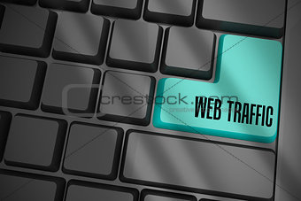Web traffic on black keyboard with blue key