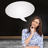 Composite image of thoughtful woman with speech bubble placing her finger on her chin