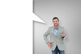 Composite image of stylish man smiling and gesturing with speech bubble