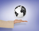 Composite image of female hand presenting globe