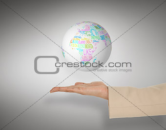 Composite image of female hand presenting globe