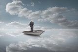 Composite image of rear view of mature businessman posing in a sailboat