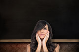 Composite image of anxious brown haired model posing holding her head