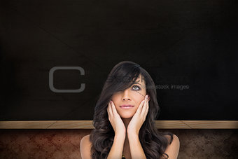 Composite image of anxious brown haired model posing holding her head