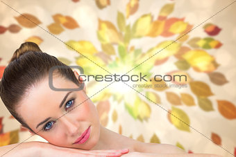 Composite image of beautiful brunette smiling at camera