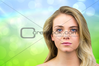 Composite image of serious blonde natural beauty