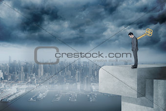 Composite image of wound up businessman with hands in pockets