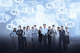 Business team against cogs and wheels background