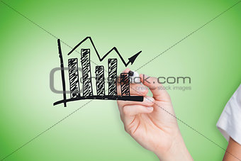Composite image of businesswoman drawing graph
