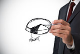 Composite image of businessman drawing pie chart
